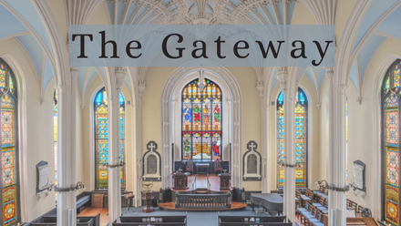 Interior view of The Unitarian Church in Charleston showcasing beautiful stained glass windows and elegant architecture.